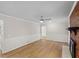 Open living room with wood floors, ceiling fan and paneled walls at 1260 White Oak Se St, Conyers, GA 30013