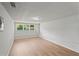 Empty room with wood floors, a window, and fresh paint at 1260 White Oak Se St, Conyers, GA 30013