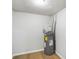 Utility room featuring a water heater and wood-look floors at 1260 White Oak Se St, Conyers, GA 30013