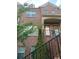 Lovely brick townhome with inviting front entrance, black railings, and well-placed windows at 1749 Breyerton Ne Dr, Atlanta, GA 30329