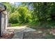 View of the backyard patio and lush greenery surrounding the property at 356 Lake Dr, Atlanta, GA 30354