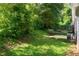 Expansive backyard featuring a small patio area and mature trees at 356 Lake Dr, Atlanta, GA 30354