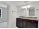 Bathroom showcasing double sinks with granite countertops, and a tile shower at 356 Lake Dr, Atlanta, GA 30354