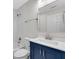 Bathroom featuring subway tile backsplash, a blue cabinet and a framed mirror above the sink at 356 Lake Dr, Atlanta, GA 30354