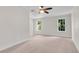 Spacious bedroom featuring two windows, carpet, and neutral paint at 356 Lake Dr, Atlanta, GA 30354