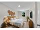 Beautifully staged main bedroom with wooden furniture, decorative wall hangings, and ample natural light at 356 Lake Dr, Atlanta, GA 30354