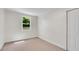 Bright bedroom features a large window that provides natural light and a neutral colored carpet at 356 Lake Dr, Atlanta, GA 30354