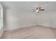 Bright bedroom with neutral carpeting, a ceiling fan, and fresh paint at 356 Lake Dr, Atlanta, GA 30354