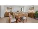 Dining area with rustic wood table set for six, with matching cabinets at 356 Lake Dr, Atlanta, GA 30354