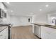 Bright kitchen features white cabinets, granite counters, stainless appliances at 356 Lake Dr, Atlanta, GA 30354