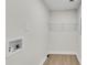 A simple laundry room with a wire rack for shelving at 356 Lake Dr, Atlanta, GA 30354