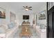 Bright living room featuring white sofas, a wood coffee table, and stylish decor at 356 Lake Dr, Atlanta, GA 30354
