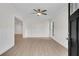 Light-filled living room featuring white walls, wood floors, and decorative paneling at 356 Lake Dr, Atlanta, GA 30354