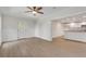 Spacious room with wood floors and view into kitchen with white cabinets at 356 Lake Dr, Atlanta, GA 30354