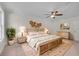 Stylishly furnished main bedroom featuring a wooden bed frame, lamps, and decorative wall art at 356 Lake Dr, Atlanta, GA 30354