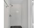 Shower featuring white subway tile and black mosaic floor tiles at 356 Lake Dr, Atlanta, GA 30354