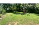 Large backyard featuring green lawn and mature trees at 2083 Meador Se Ave, Atlanta, GA 30315