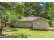 Exterior shows a brick building with a grassy yard and overgrown trees at 2083 Meador Se Ave, Atlanta, GA 30315
