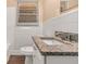 Updated bathroom featuring a tiled shower and granite vanity at 2083 Meador Se Ave, Atlanta, GA 30315