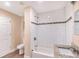 Updated bathroom featuring a tiled shower and granite vanity at 2083 Meador Se Ave, Atlanta, GA 30315