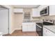 Stylish kitchen with granite countertops, stainless steel appliances, and white cabinets at 2083 Meador Se Ave, Atlanta, GA 30315