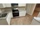 Bright kitchen featuring updated countertops, stainless steel oven and sleek white cabinetry at 2083 Meador Se Ave, Atlanta, GA 30315