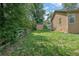 Green backyard space with fencing and storage shed, ideal for outdoor activities and storage at 219 1St St, Woodstock, GA 30188