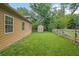 Fenced backyard features a shed and grassy area, providing a safe and private outdoor space at 219 1St St, Woodstock, GA 30188