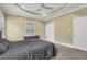 This bedroom features natural light, a ceiling fan, and two closets for plenty of storage space at 219 1St St, Woodstock, GA 30188