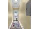 A clean and well-lit hallway with hardwood floors and a patterned rug at 219 1St St, Woodstock, GA 30188
