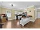Bright kitchen boasts stainless steel appliances, white cabinets, and a central island for added workspace at 219 1St St, Woodstock, GA 30188