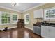 Well-appointed kitchen area with bright natural light, modern appliances, and ample counter space at 219 1St St, Woodstock, GA 30188