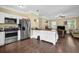 Modern kitchen with stainless steel appliances and a breakfast bar overlooking the living room at 219 1St St, Woodstock, GA 30188