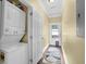 Convenient laundry area with stacked washer and dryer, plus access to the backyard at 219 1St St, Woodstock, GA 30188