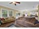 Open living area with hardwood floors, neutral walls, and access to the kitchen at 219 1St St, Woodstock, GA 30188