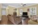 Living room with hardwood floors, crown molding, and abundant natural light at 219 1St St, Woodstock, GA 30188
