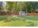 Relaxing backyard scene with a swing set, shed and privacy fence, offering a peaceful retreat at 425 Houze Way, Roswell, GA 30076