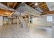 Unfinished basement featuring exposed ductwork and wooden ceiling beams at 425 Houze Way, Roswell, GA 30076