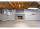 Finished basement featuring a brick fireplace and neutral flooring at 425 Houze Way, Roswell, GA 30076
