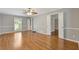 Bedroom with hardwood floors, neutral paint, a ceiling fan, large windows and plenty of space at 425 Houze Way, Roswell, GA 30076