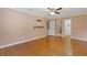 Large bedroom features hardwood floors, neutral wall color, ceiling fan and walk in closet at 425 Houze Way, Roswell, GA 30076