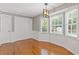 Cozy dining area with hardwood floors and bay windows, bathed in natural light, perfect for enjoying everyday meals at 425 Houze Way, Roswell, GA 30076
