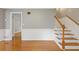 Welcoming foyer featuring hardwood floors, a staircase and fresh, neutral paint colors at 425 Houze Way, Roswell, GA 30076