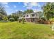 Charming two-story home with a brick and white facade and beautifully landscaped front yard at 425 Houze Way, Roswell, GA 30076