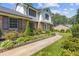 Attractive two-story home with brick accents, lush landscaping and well-maintained walkway at 425 Houze Way, Roswell, GA 30076