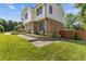 Lovely two-story home with brick details and professional landscaping, including shrubs and a paved walkway at 425 Houze Way, Roswell, GA 30076
