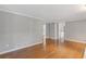 Spacious living room featuring hardwood floors and neutral-toned walls for versatile decor options at 425 Houze Way, Roswell, GA 30076
