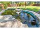 Backyard pond with rock details and clear water, providing a serene outdoor retreat at 425 Houze Way, Roswell, GA 30076
