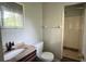 Bathroom features a vanity, toilet, window, and tiled walk-in shower at 4550 Cypress Ridge Ct, Stone Mountain, GA 30083