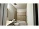 Compact bathroom with a combination tub and shower, vanity, and neutral decor at 4550 Cypress Ridge Ct, Stone Mountain, GA 30083